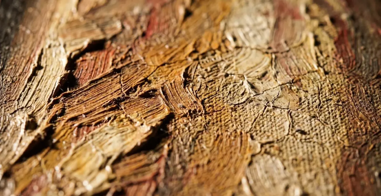 Dramatic raking light revealing canvas surface texture and brushwork detail