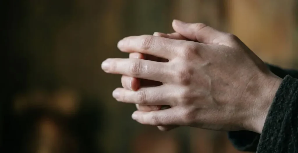 Close-up study of elegant Renaissance hands positioned in expressive gesture revealing emotional complexity